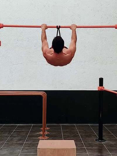 Elastic band assisted front lever