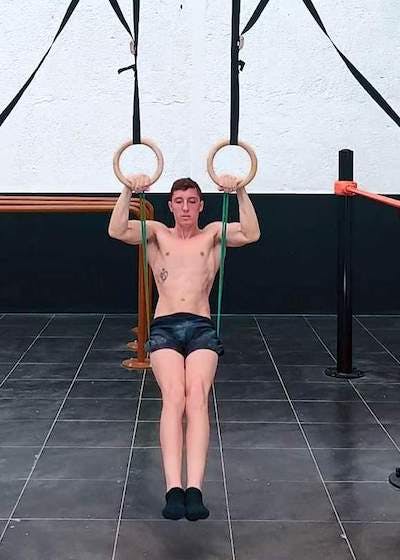 Elastic band assisted rings muscle up