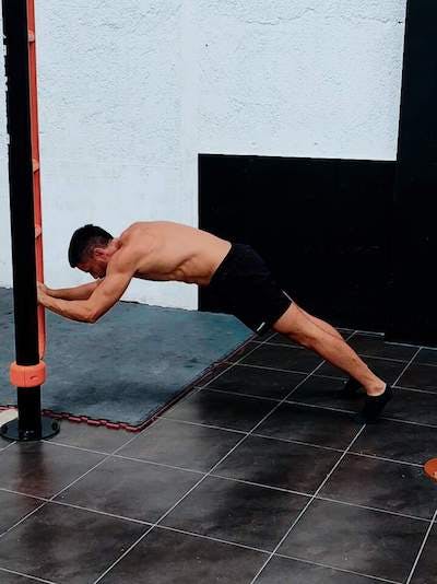 Triceps extensions against low bar