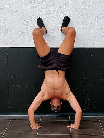Negative to assisted handstand push-up