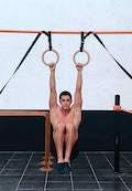 Tucked front lever raises on rings