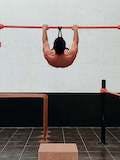 Elastic band assisted front lever