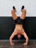 Negative to assisted handstand push-up